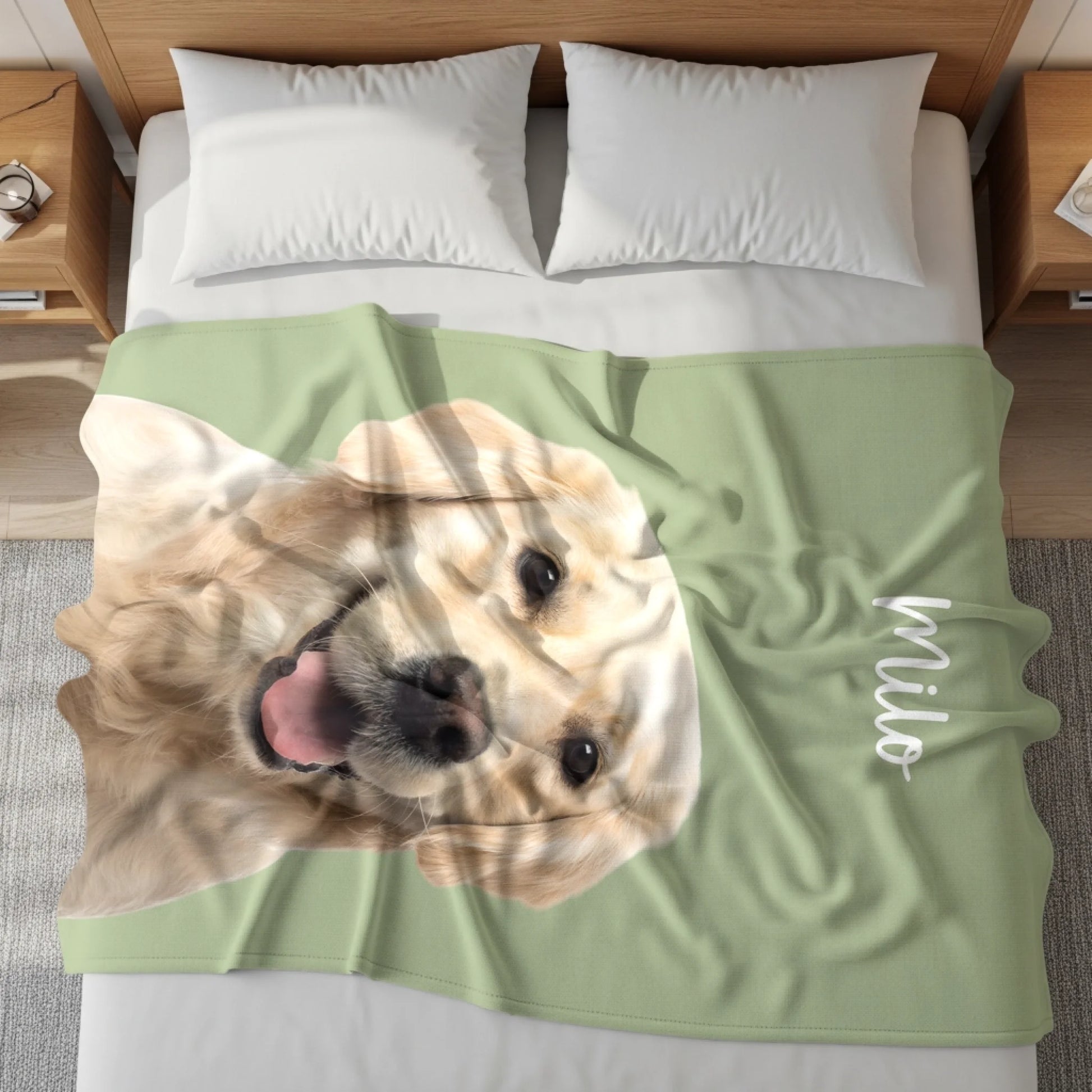 Personalized pet blanket in sage green featuring a printed golden retriever portrait, laid across a bed.