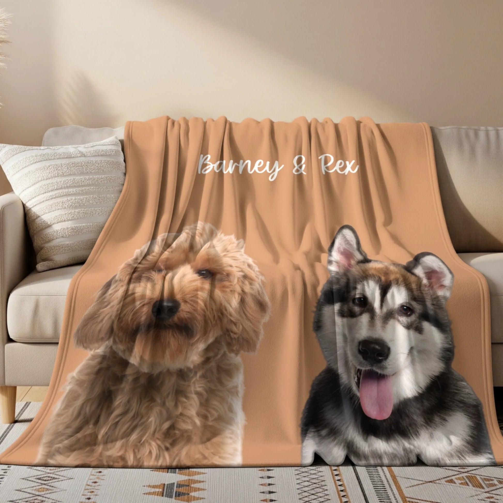 Custom fleece blanket with portraits of a Cockapoo and a Husky and personalized text, styled on a living room sofa.
